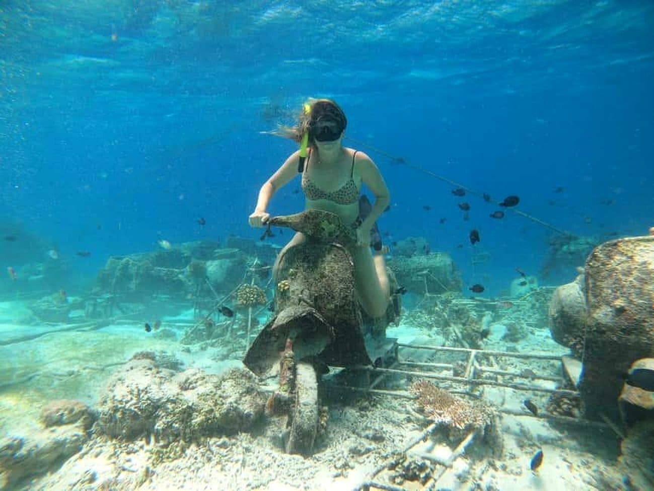 Snorkeler at the underwater vespa in Gili Meno