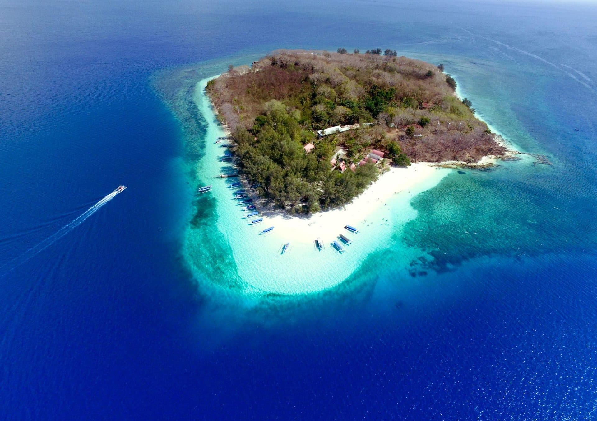 Aerial view of tiny Gili Nanggu and its turquoise reef