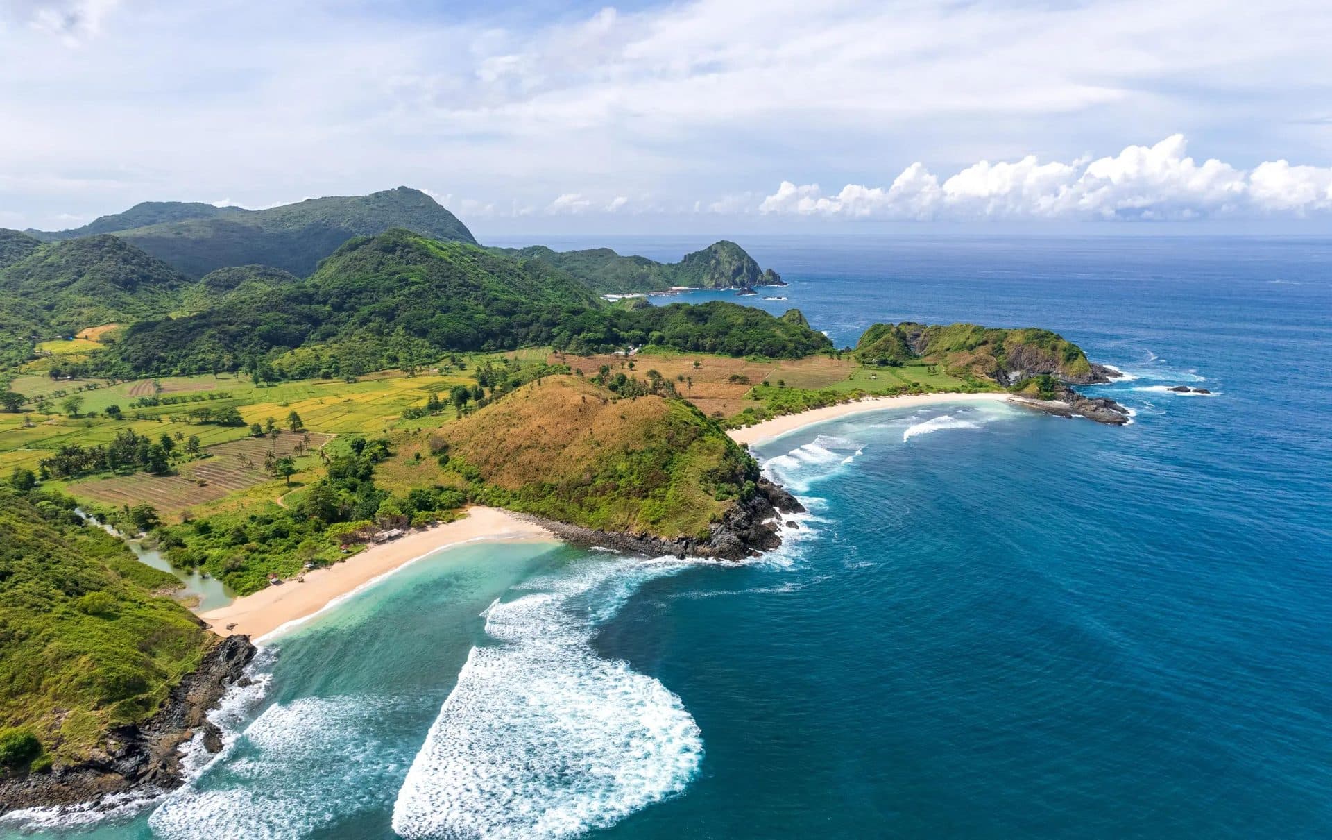 Aerial view of Mawi Beach’s wild southern coastline