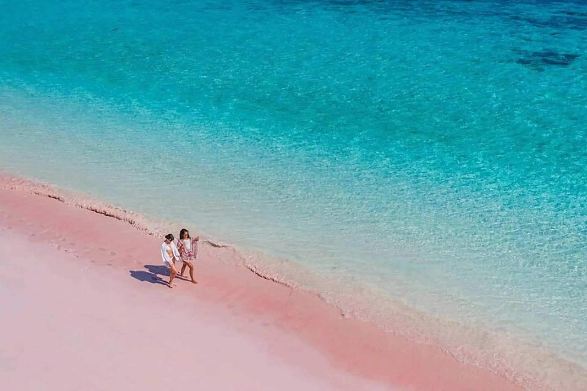 Walking the pink-tinted sand at Pink Beach Lombok