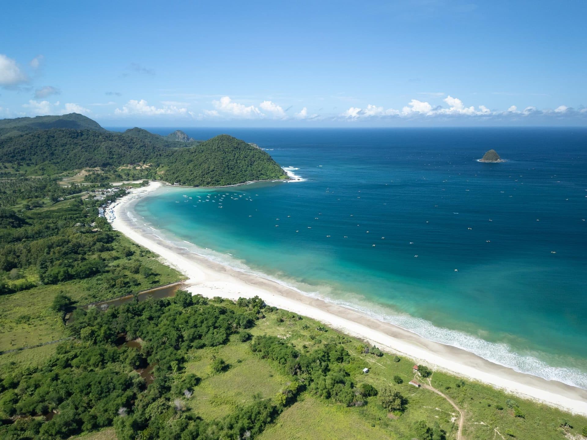 Long white shoreline at Selong Belanak