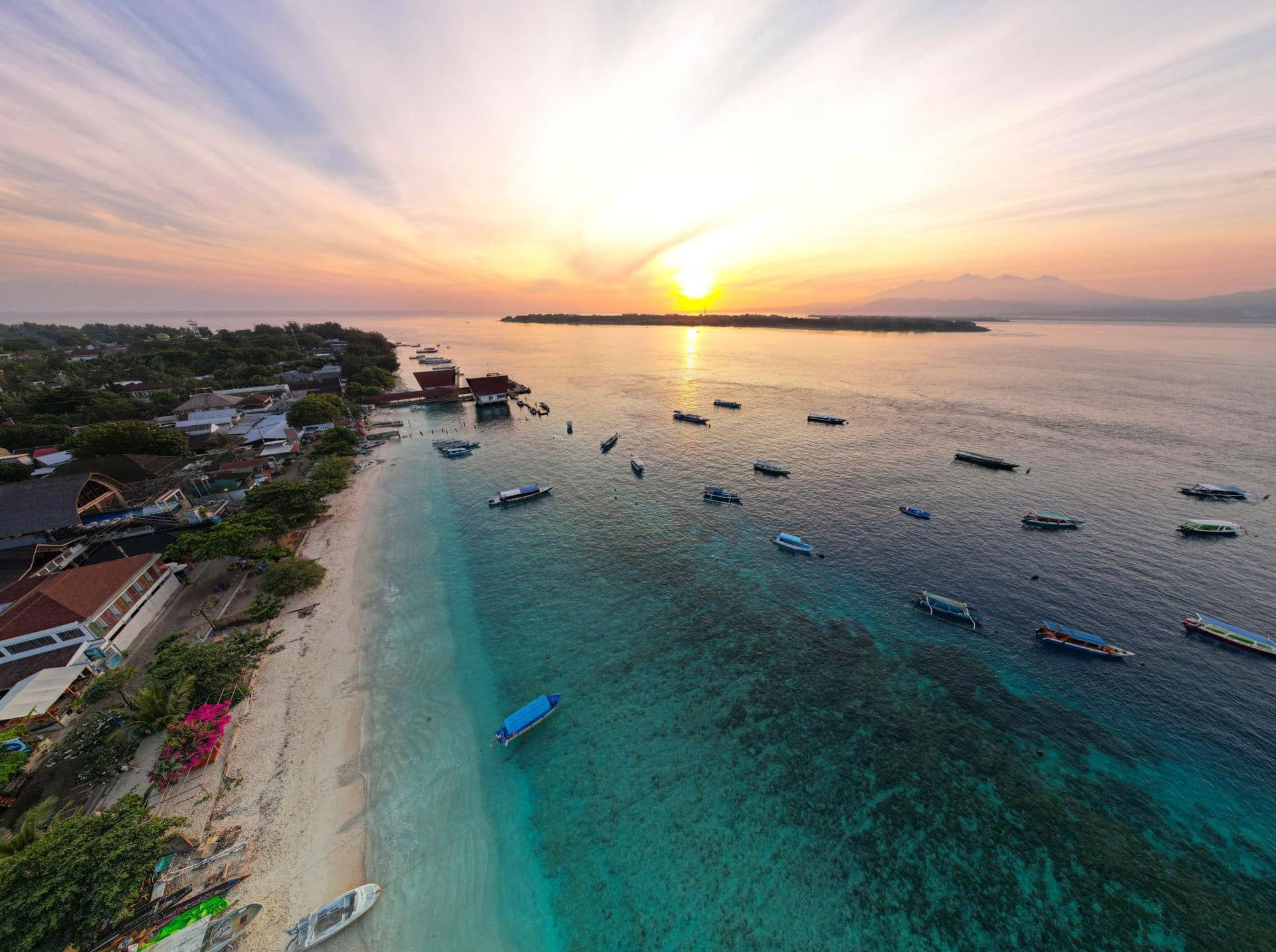 Gili Trawangan beach and boats at sunset, the destination of boats from Padang Bai