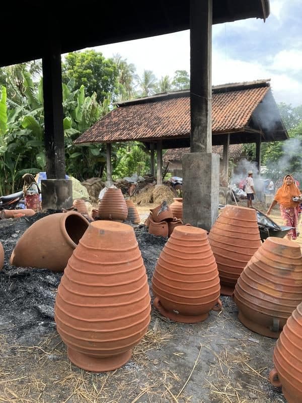 Freshly fired terracotta pots cooling in a Banyumulek workshop yard