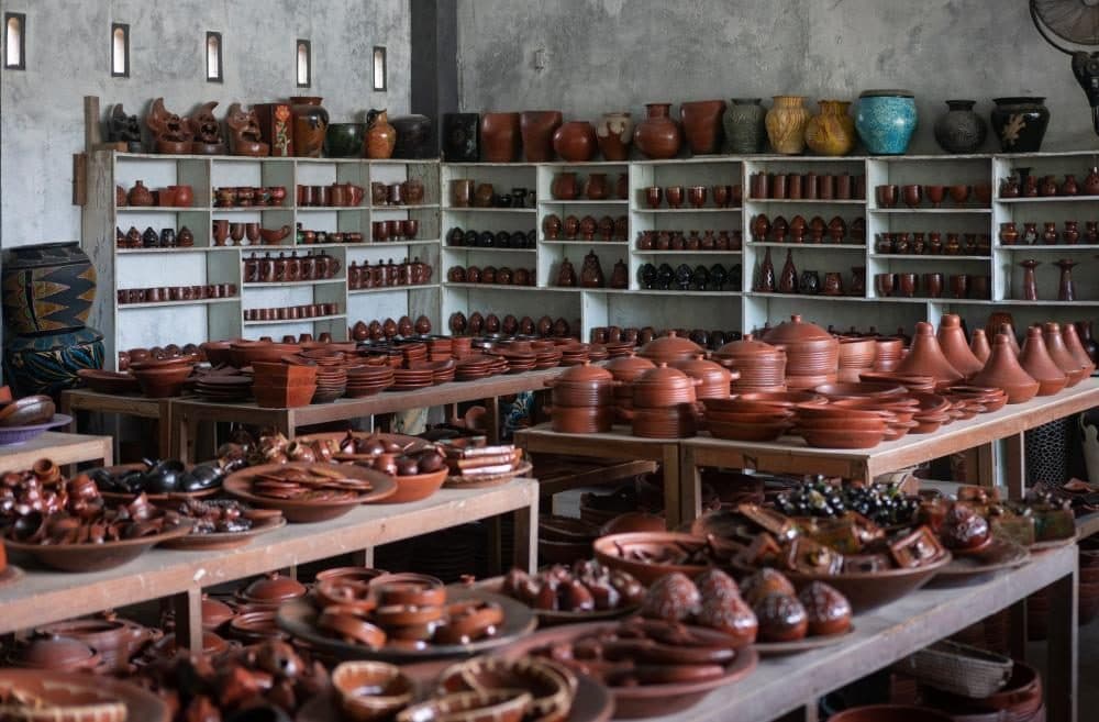 A Banyumulek pottery shop filled with handmade bowls, pots, and plates