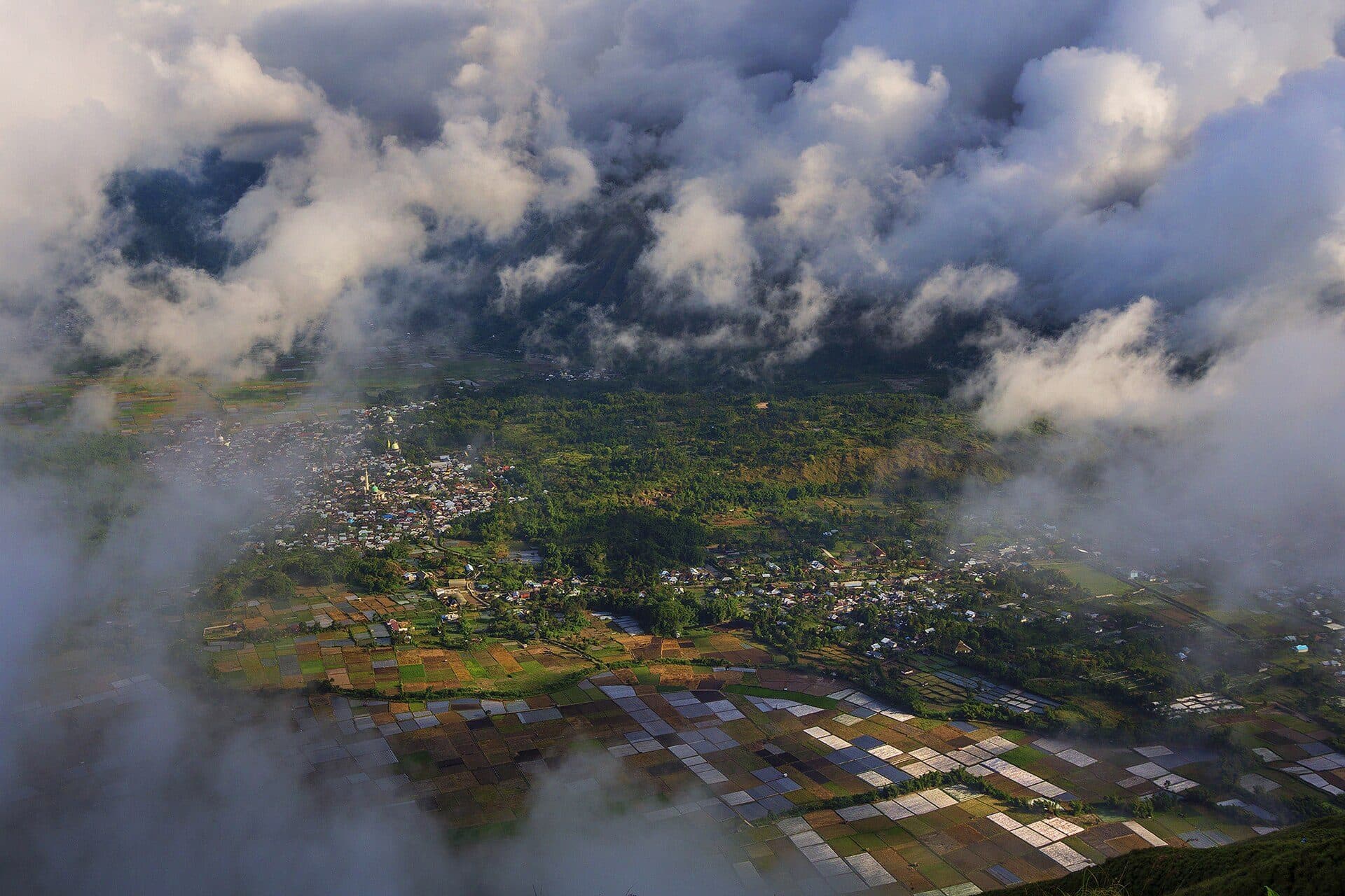 Sembalun village and farmland seen through highland cloud