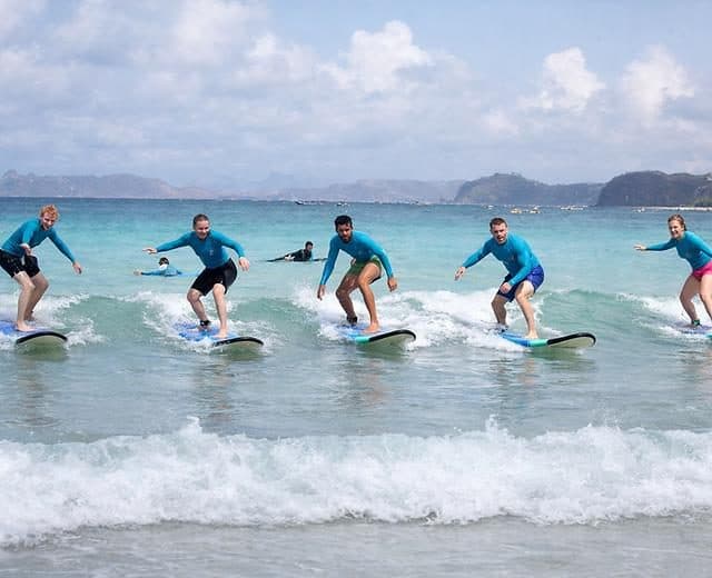 Group of beginners on small waves