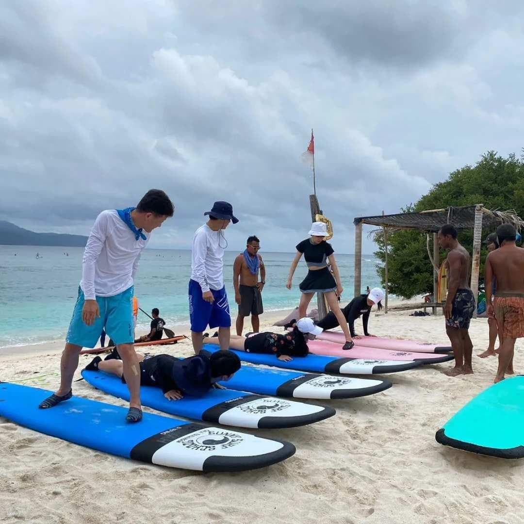 Beach surf lesson with multiple boards